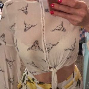 Super cute top with goat heads... never worn!